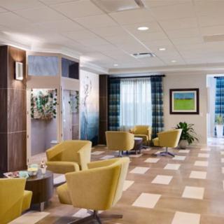 A modern lobby with stylish seating and decorative artwork.