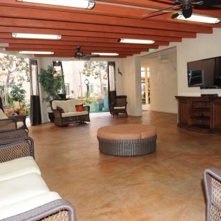 Spacious living room with modern furniture and ample natural light.