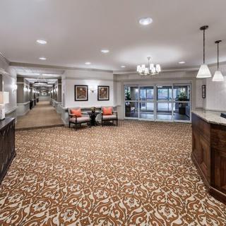 Spacious hotel lobby with elegant decor and comfortable seating.