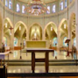 A beautifully decorated church interior featuring an altar and ornate architecture.