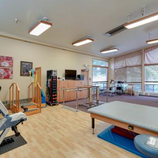 A well-equipped physical therapy room designed for rehabilitation activities.