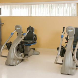 A gym room with modern exercise equipment.