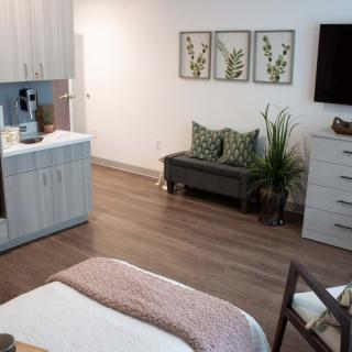 A modern and minimalist bedroom with sleek furniture and tasteful decor.