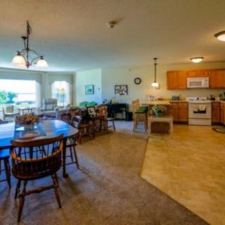 Spacious open-plan kitchen and dining area with modern furnishings.