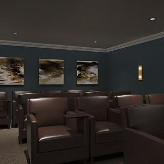 A modern home theater room with comfortable armchairs and stylish decor.