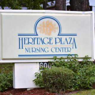 Sign for Heritage Plaza Nursing Center indicating the location and services offered.