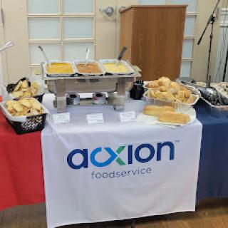 A catering setup featuring a variety of dishes on display.
