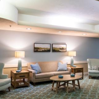 A cozy living room with modern furniture and soft lighting.