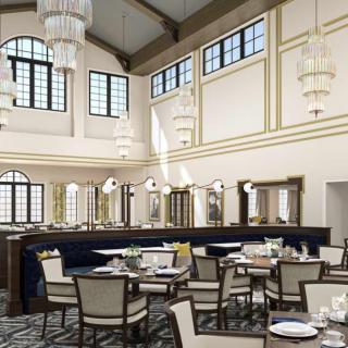 An elegant restaurant interior with tasteful chandeliers and neatly arranged dining tables.