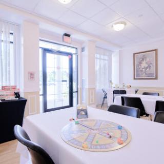 A bright and inviting dining area with a game board set up on the table.