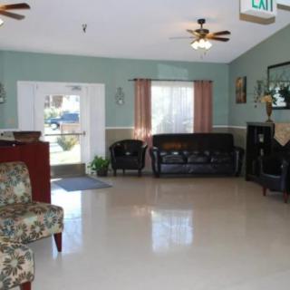 A cozy lobby area with sofas, chairs, and a welcoming entrance.