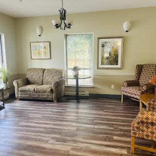 A cozy living room featuring comfortable seating and warm decor.