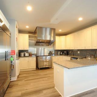 A modern kitchen with stainless steel appliances and sleek cabinetry.