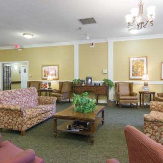 A cozy living room with comfortable seating and elegant decor.