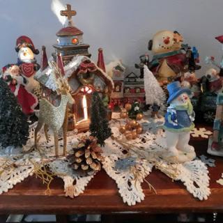 A charming holiday display featuring various Christmas figurines and decorations.