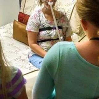 A person undergoing a sleep study with a CPAP machine in a bedroom setting.