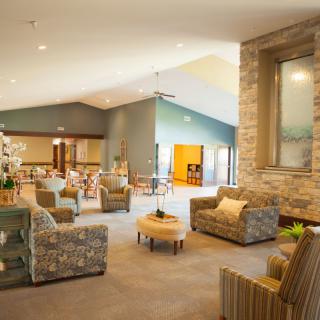 A spacious and modern lounge with comfortable seating and a cozy atmosphere.