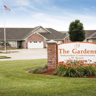 A scenic view of The Gardens, showcasing independent condominiums with well-maintained landscaping.