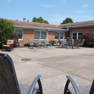 A spacious outdoor seating area with patio furniture, perfect for relaxing on a sunny day.