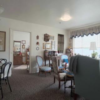 A cozy vintage living room with classic furniture and soft lighting.