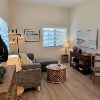 A cozy living room featuring modern furniture and decor with soft lighting.