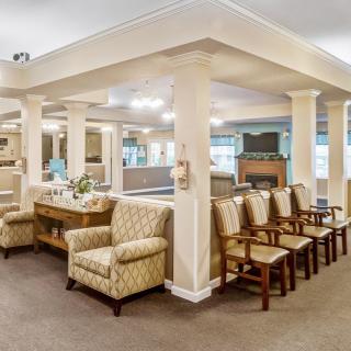 A spacious waiting area with comfortable seating and elegant decor.