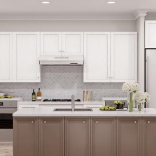 A modern kitchen with white cabinets, stainless steel appliances, and a central island featuring flowers as decoration.