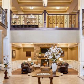 A modern lobby area with elegant furniture and decorative elements.
