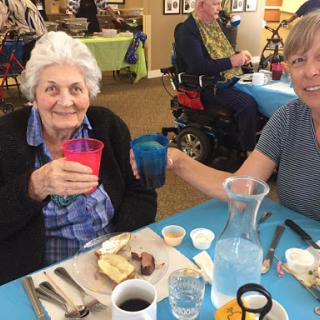 Enjoying a delightful meal together, sharing smiles and good company.