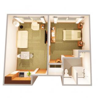 A minimalist floor plan illustrating a compact studio apartment with a bedroom and living space.
