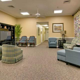 A cozy living room with comfortable seating and a large TV.