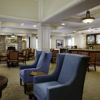 A cozy lounge area featuring comfortable seating and elegant decor.