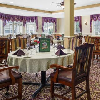 Elegant dining area with neatly arranged tables and chairs.