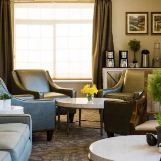 A cozy and modern living room with comfortable seating and natural light.