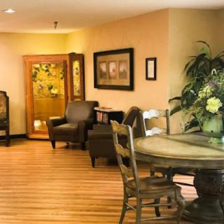 A cozy living room with elegant furniture and decorative elements.