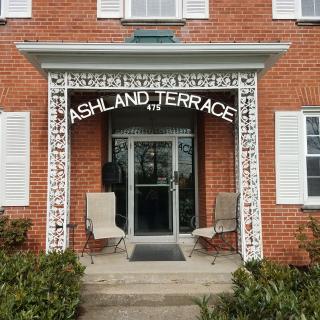 Entrance to a building with 'Ashland Terrace' signage above the door.