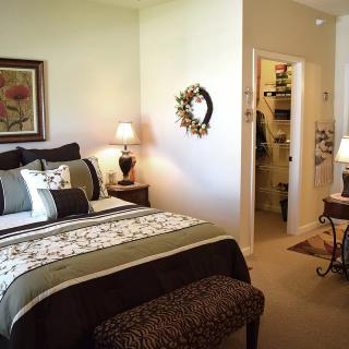 A cozy bedroom with elegant decor and a walk-in closet.