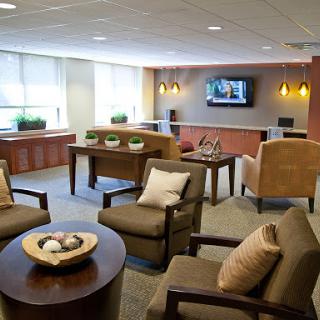 A stylish and inviting lounge area with modern furniture and soft lighting.