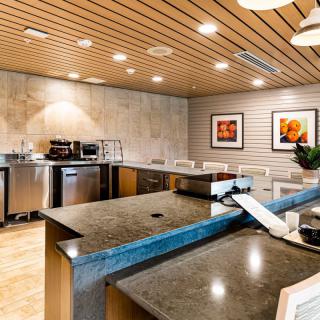 A modern kitchen interior with sleek countertops and appliances.