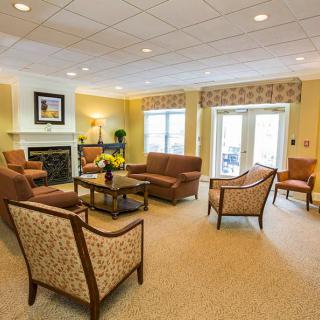 A cozy living room with comfortable seating and a fireplace.