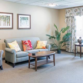 A cozy, well-decorated living room with a sofa and coffee table.