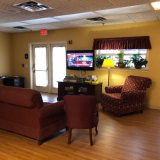 A cozy living room with comfortable seating and a television.