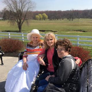 A joyful moment captured in the park, showcasing a group of women enjoying their time together.