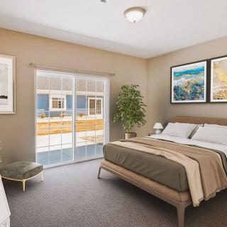 A modern and cozy bedroom with minimalist decor, featuring a large bed, wall art, and a potted plant by sliding glass doors.