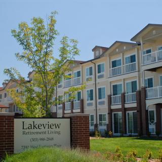 Exterior view of Lakeview Retirement Living building with a welcoming sign.