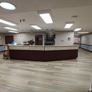 A spacious reception area with modern decor and lighting.