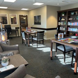 A cozy library with comfortable seating and well-stocked bookshelves.