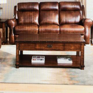 A cozy living room setup featuring a leather sofa and a wooden coffee table.