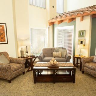 A cozy living room with comfortable seating and warm decor.