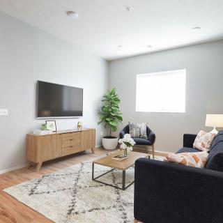 A modern living room with sleek furniture and a cozy atmosphere.